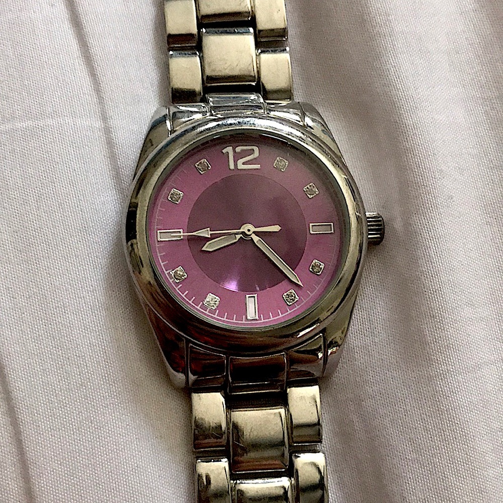 The brand is unknown. Silver and purple.